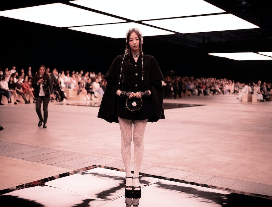fashion stage person clothing footwear shoe people coat face crowd