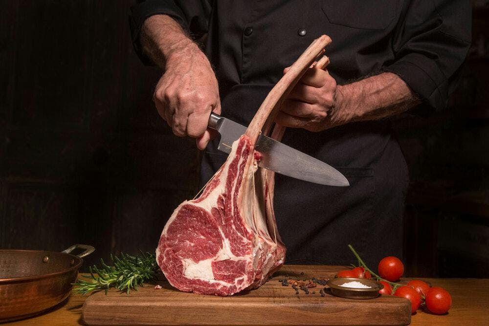 getty images lamb cutting lamb meat butcher lamb cuts person human butcher shop shop