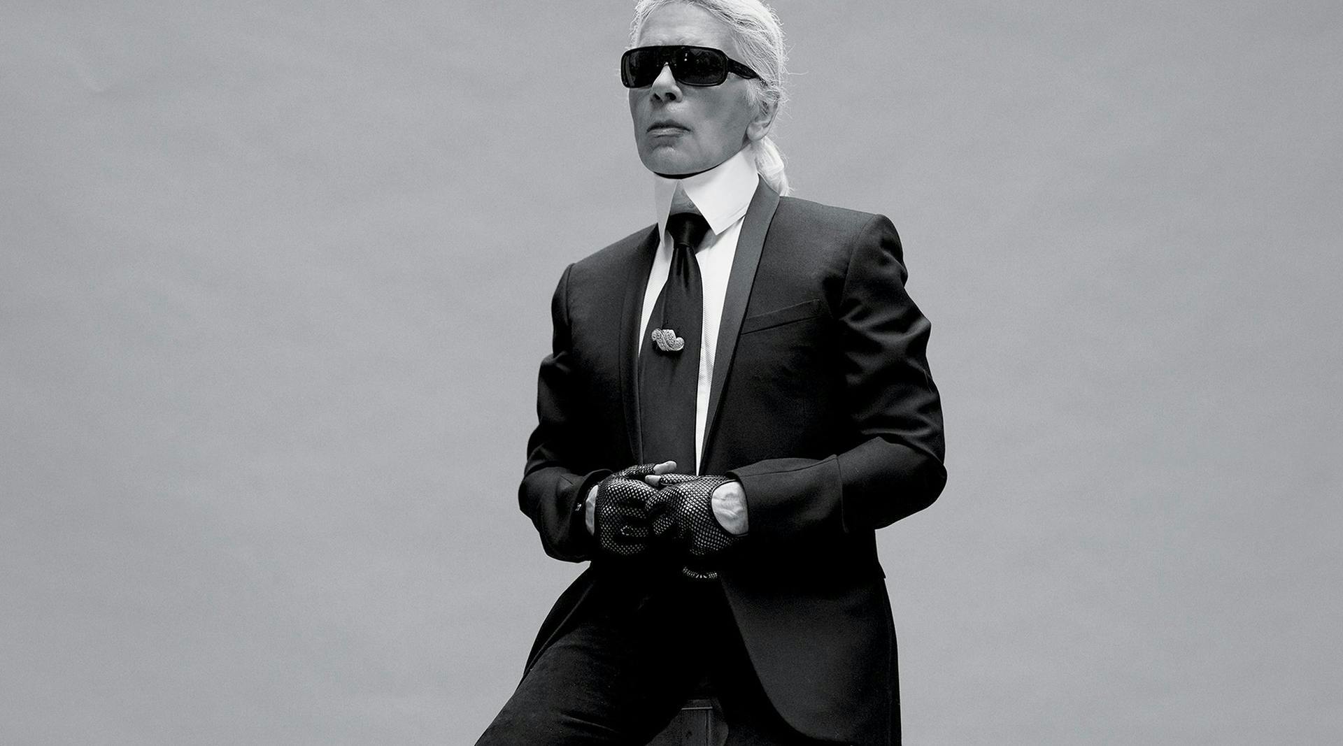 clothing apparel suit overcoat coat person human tie accessories sunglasses