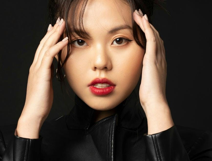 face person human clothing apparel jacket coat lipstick cosmetics