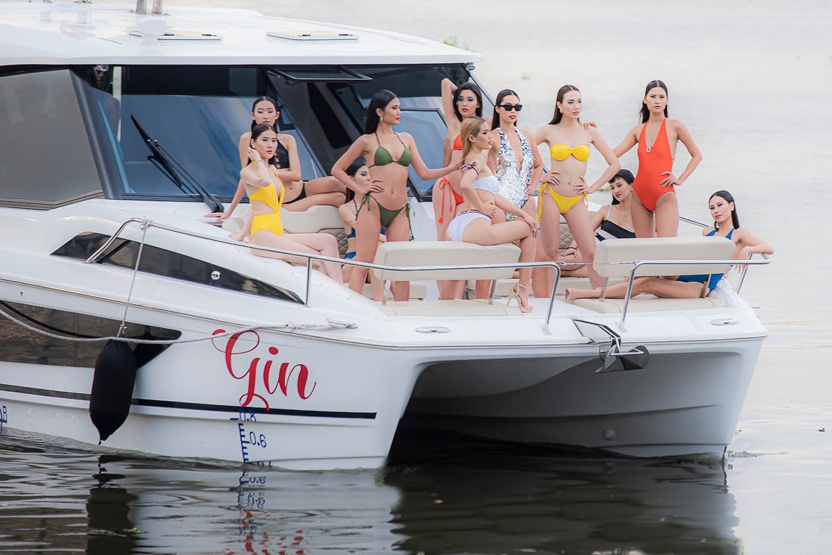 boat transportation vehicle clothing person watercraft bikini swimwear sunglasses accessories