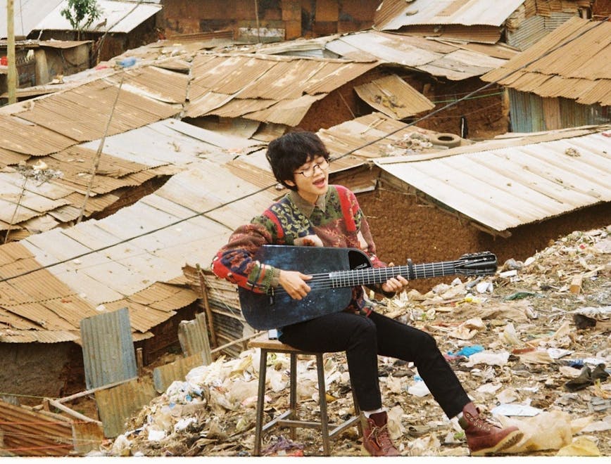 person urban guitar musical instrument leisure activities shoe clothing footwear slum building