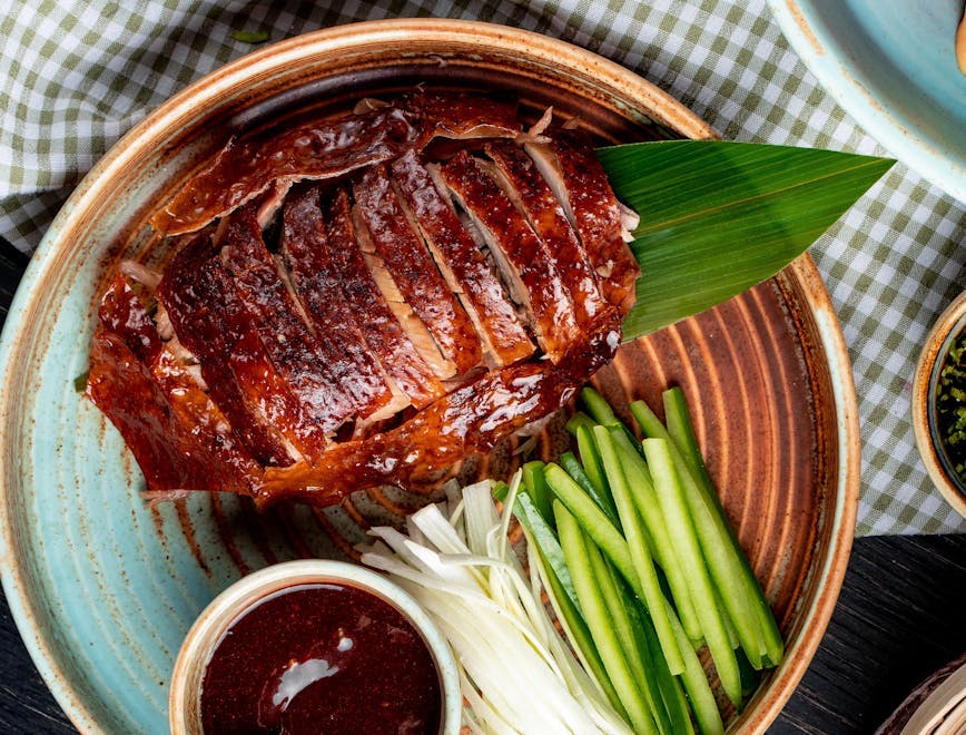 top view traditional asian food peking duck cucumbers sauce plate roasted gourmet meat dish beijing china chinese meal roast cuisine dinner cooked grilled cooking asia service pork