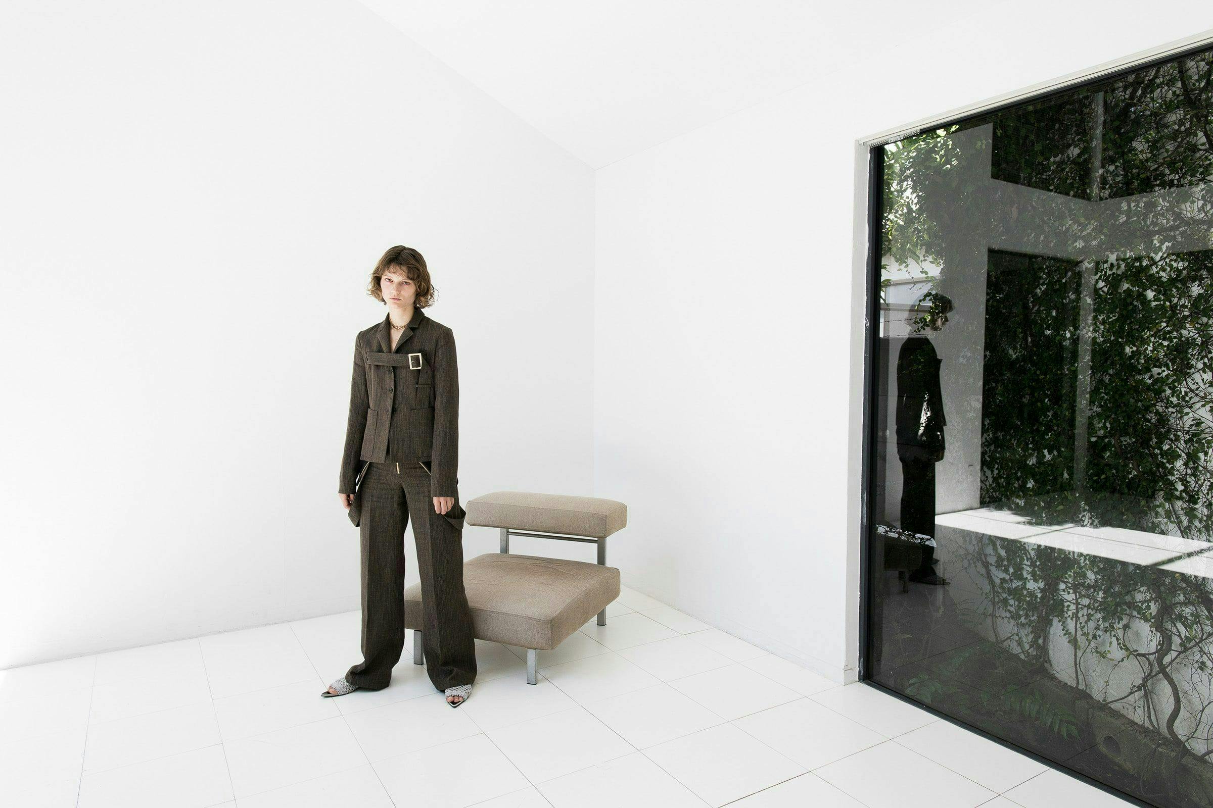 flooring person human clothing apparel floor furniture suit coat overcoat