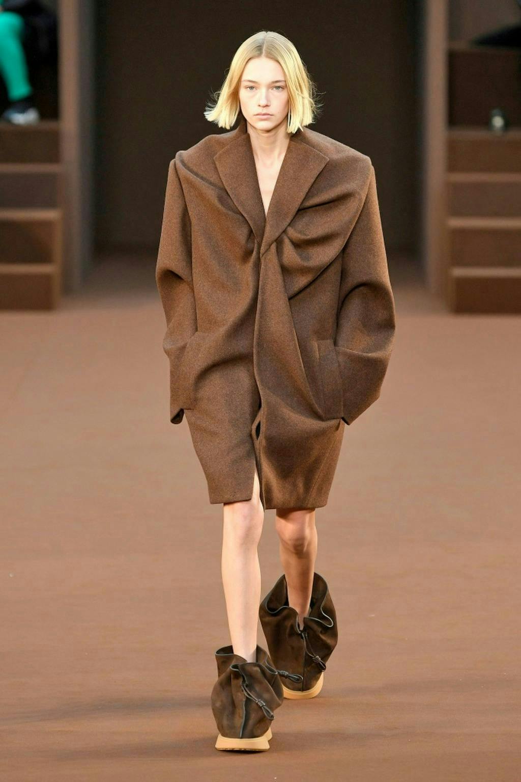 clothing apparel coat overcoat person human shoe footwear