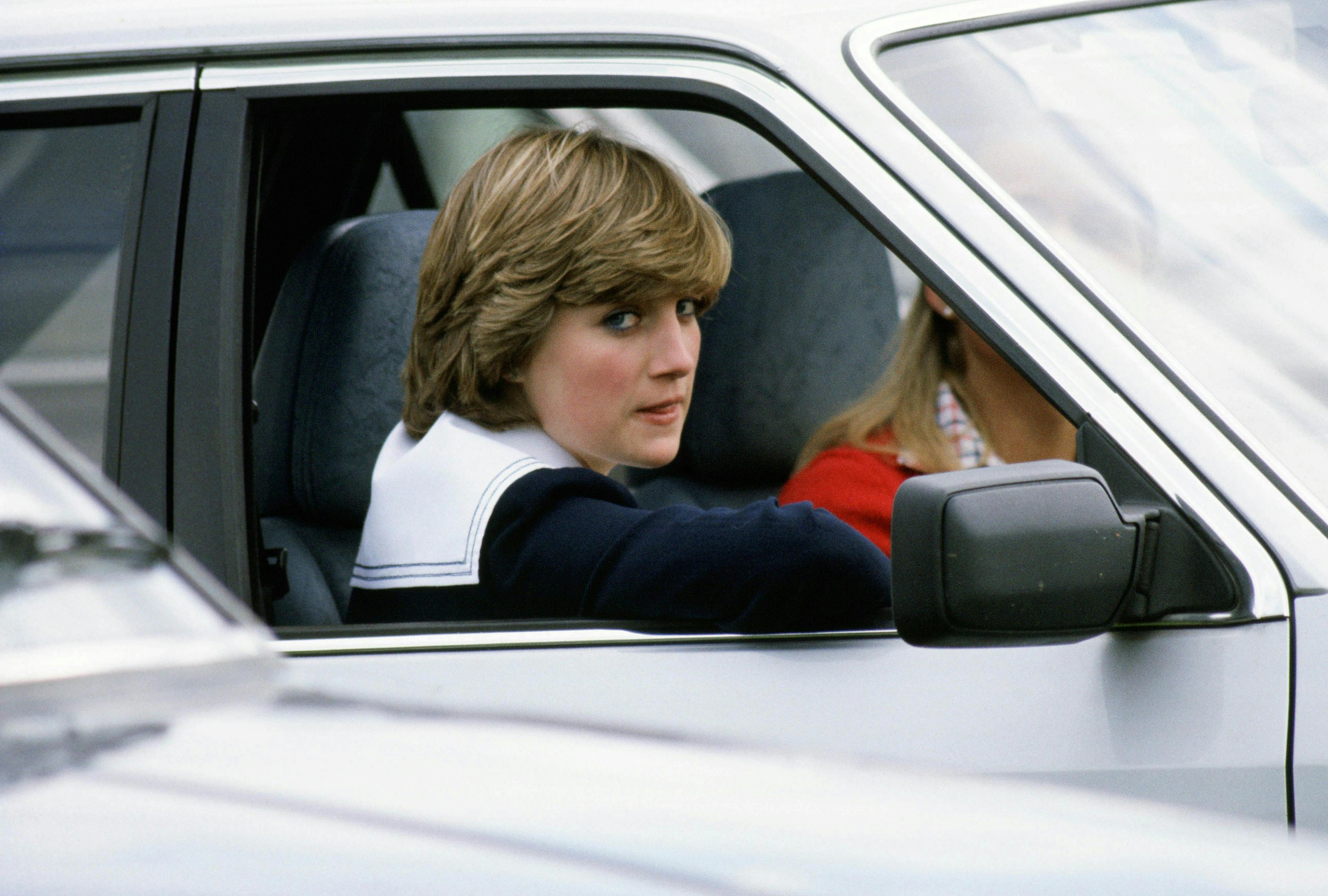 angry british royal family diana princess of wales driving equestrian events equestrian sports eye contact half length half-lengths off duty polo private cars recreation royal transportation royals royalty serious person human car transportation vehicle automobile cushion mirror car mirror