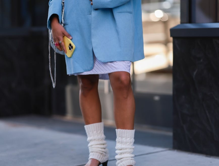 shorts clothing coat shoe person sneaker ring skirt blazer mobile phone