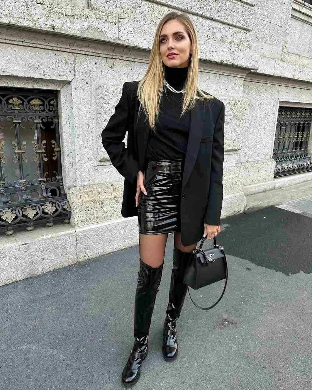 coat clothing blazer jacket person shoe footwear skirt blonde hair