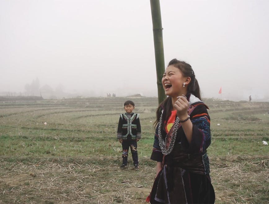 face head person happy grass laughing outdoors nature field portrait
