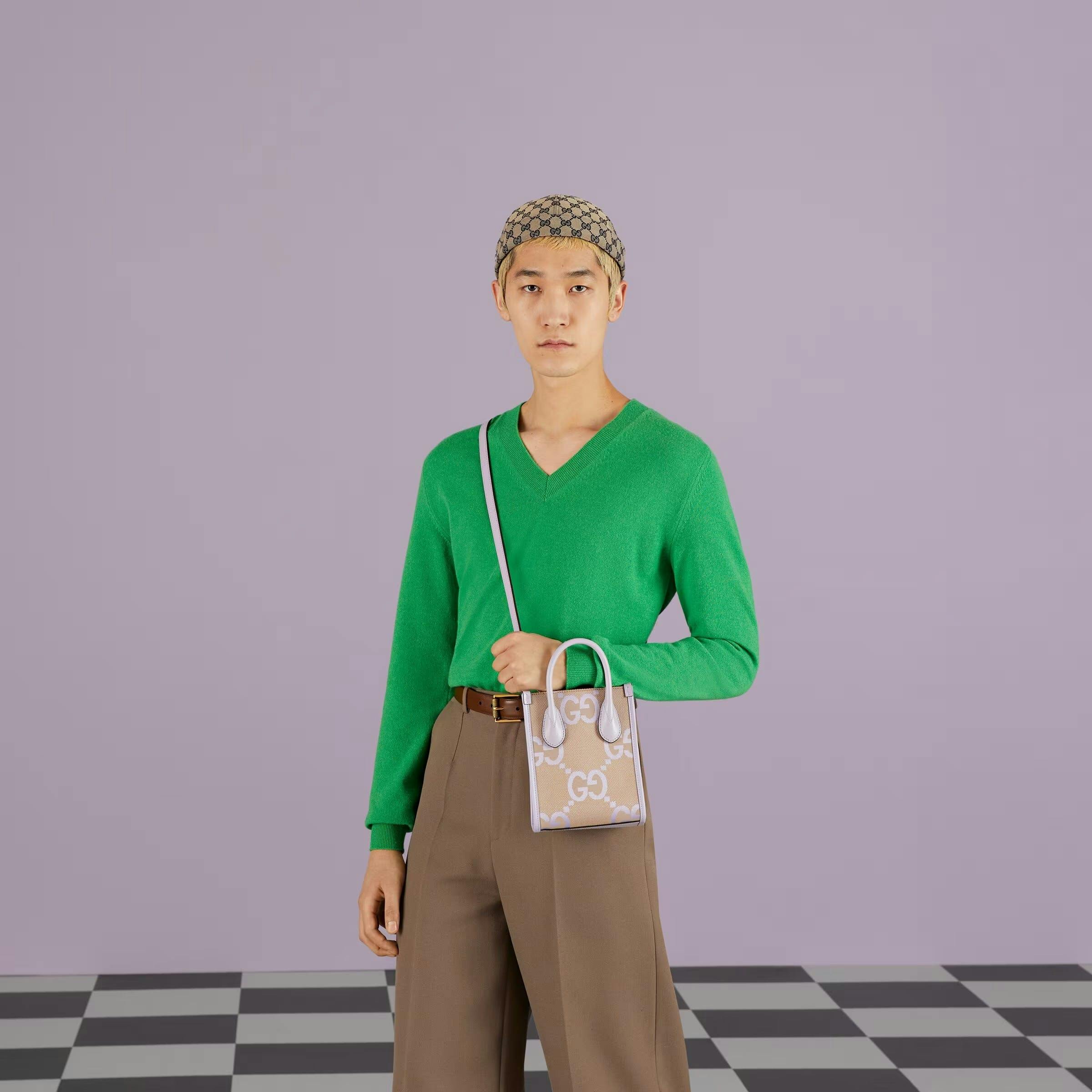 handbag bag accessories long sleeve sleeve clothing sweater knitwear purse person