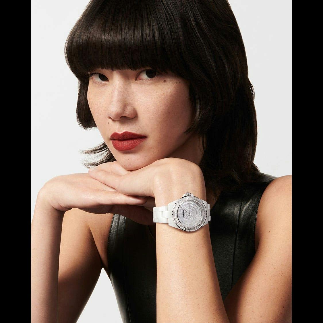 person wrist adult female woman face portrait arm finger wristwatch