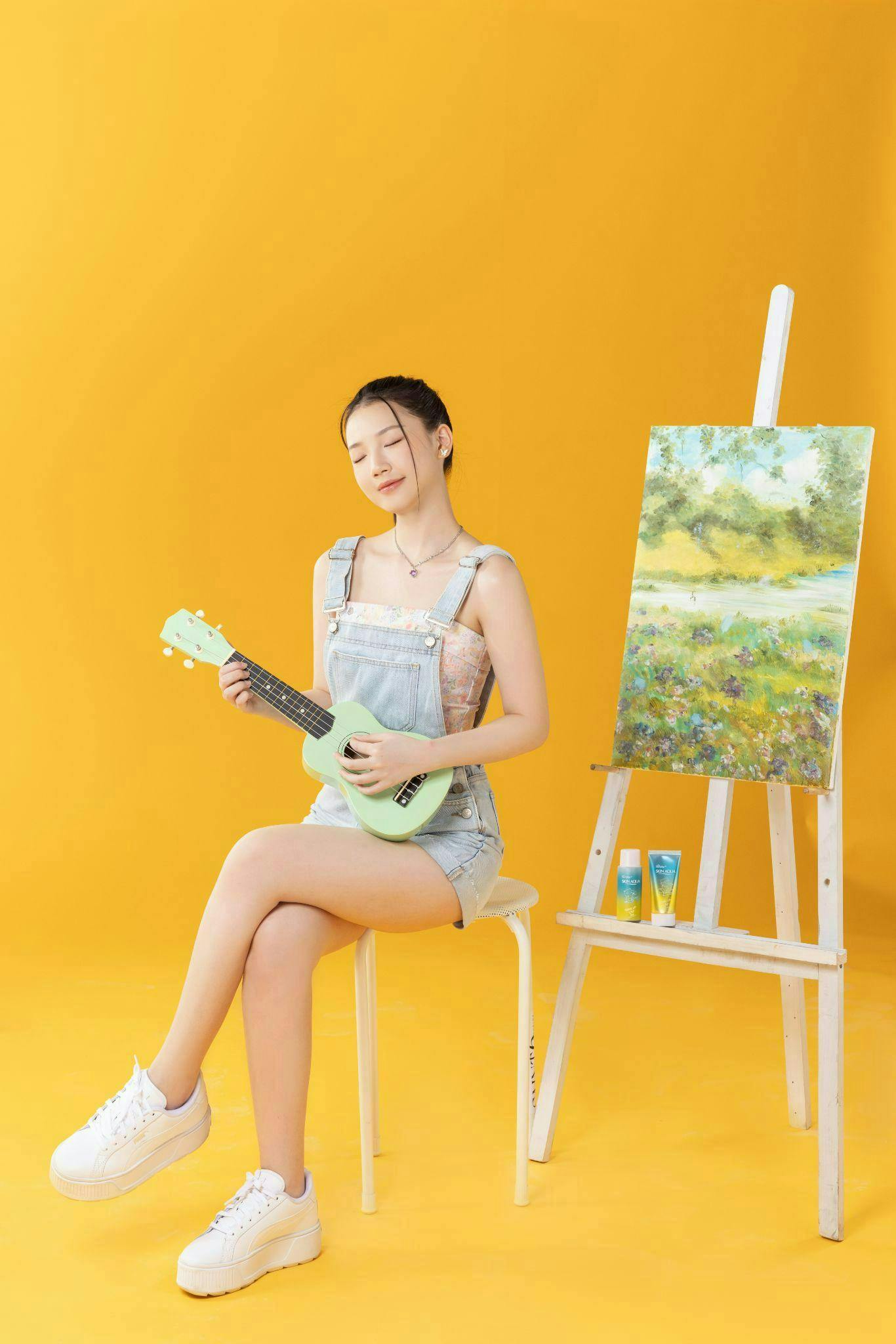 person sitting art painting guitar musical instrument performer