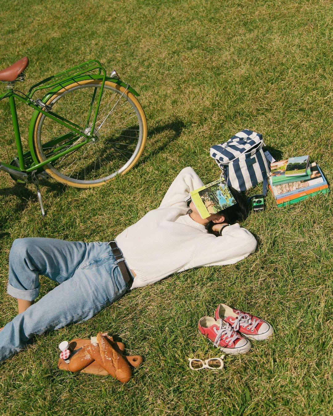 shoe grass pants person photography portrait wheel reading sneaker lawn