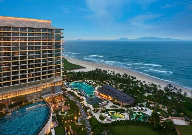 building hotel resort nature outdoors sea water swimming pool shoreline coast
