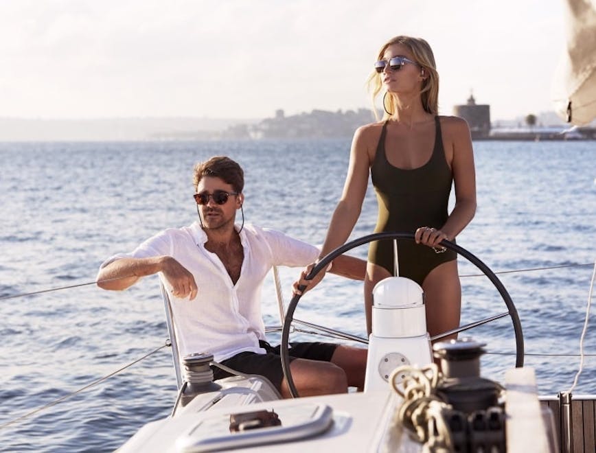 vehicle yacht adult female person woman male man glasses vacation