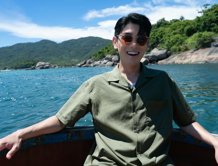 person smile finger nature promontory summer portrait land sunglasses boat
