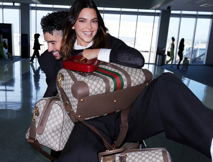 handbag adult female person woman airport purse baggage face man