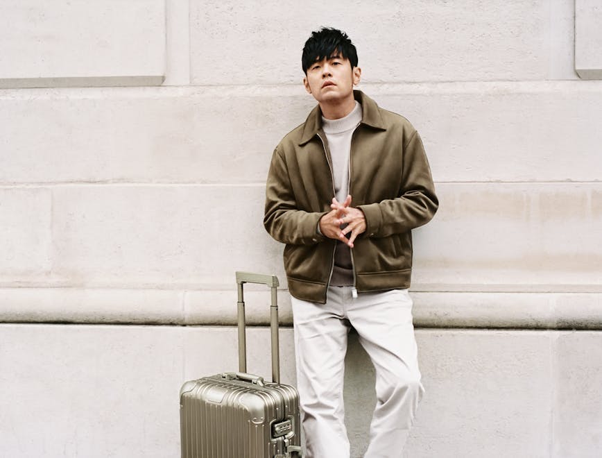 clothing coat jacket adult male man person baggage