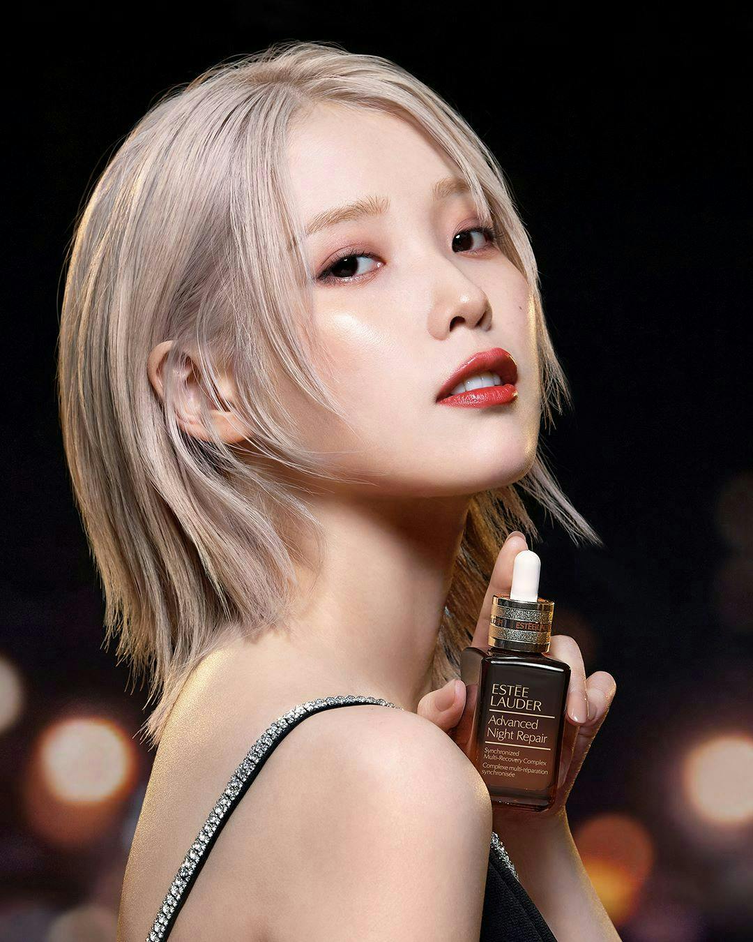 blonde hair person bottle cosmetics perfume