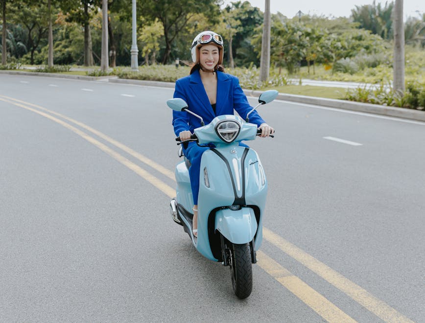 helmet adult female person woman glove scooter vehicle motorcycle glasses