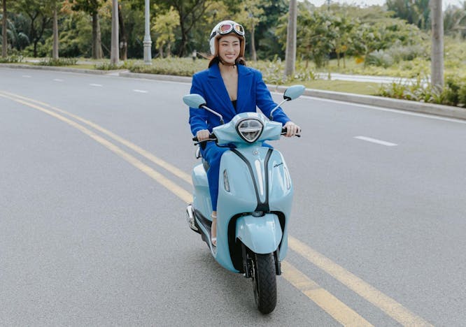 adult female person woman scooter transportation vehicle motorcycle